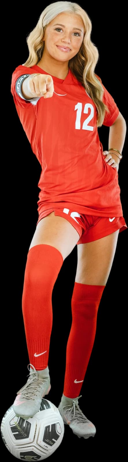 Shiah Webber of Team SOLO, pointing toward you with her foot on a soccer ball